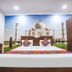 Hotel Taj Heritage, Agra guest room with Taj Mahal wall mural, king bed, and wardrobe
