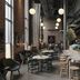 The Winery Hotel, Solna lounge with high tables, stools, hanging lights and brick walls