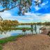 Stonewell Cottages and Vineyards in Tanunda with lake view, wooden dock and landscaped grounds