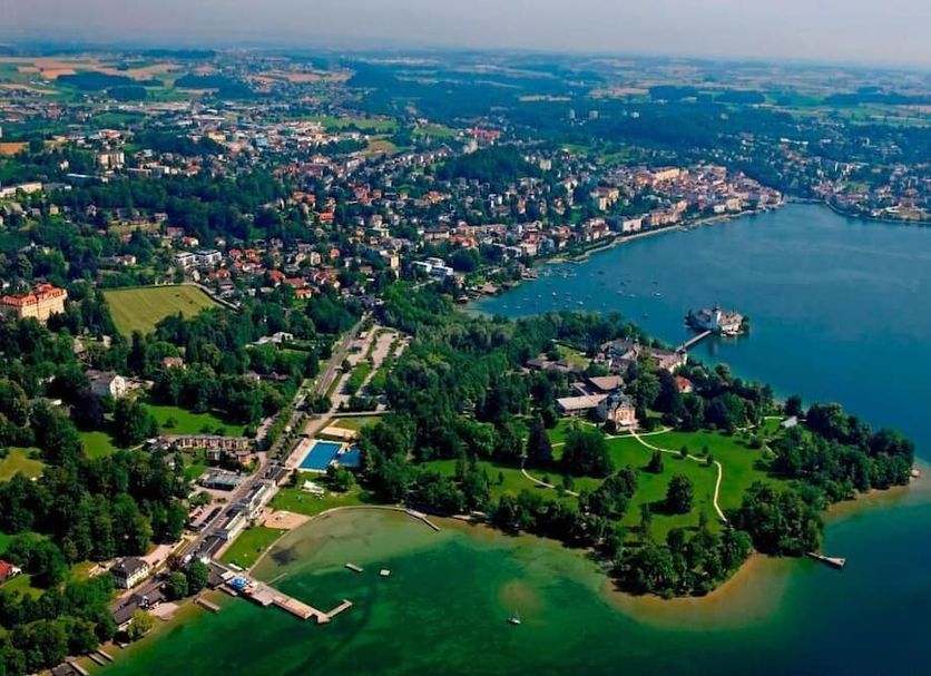 Landhotel Grünberg am See in Gmunden with aerial view of lake, shoreline, and surrounding town