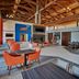 Holiday Inn Express Nashville Airport lobby with orange chairs, fireplace, and wood-beam ceiling