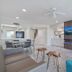 Bridgewalk, a Landmark Resort in Bradenton Beach: modern suite with seating area and wall-mounted TV
