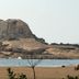 The Beach Camp Yala in Kirinda with a rocky coastal hill and beach view
