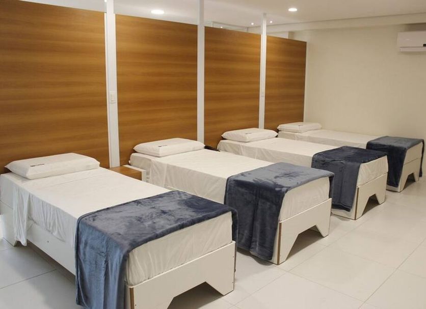 Floresta Hotel in Sao Paulo room with four single beds and white tile floor
