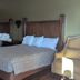 Western Inn Motel & RV Park in Fairplay: room with two beds and an armchair