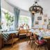 Zum Ochsen, Schallstadt: cozy hotel dining room with set tables, window seating, and wall art