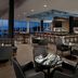 Delta Hotels by Marriott Thunder Bay lounge bar with lake view and city skyline at dusk
