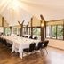 Steventon House Hotel in Abingdon dining room with long set banquet table and large windows