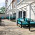 Hampton Inn ATL-Lawrenceville-I-85-Sugarloaf patio with turquoise lounge chairs and outdoor seating