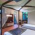 Splanzia Boutique Hotel in Chania, four-poster bed and canopy-draped guest room with wooden floor