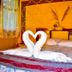 Salkantay Hostel Chaullay room in Santa Teresa with bed and towel swans