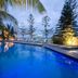 Silvershore Apartments on the Broadwater pool at dusk with ocean view in Biggera Waters