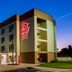 Red Roof Inn & Suites Fayetteville-Fort Bragg exterior at dusk in Fayetteville