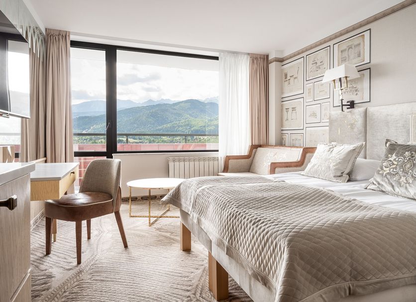 Bachleda Hotel Kasprowy in Zakopane guest room with twin beds and mountain-view balcony
