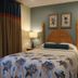 The Cove at Yarmouth by Westgate Resorts guest room with king bed and nautical decor in West Yarmouth
