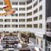 Holiday Inn Montreal-Longueuil By IHG atrium with suspended airplane and lobby seating in Longueuil