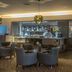 Maldron Hotel Dublin Airport lounge bar with armchairs and counter seating in Dublin