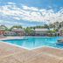 Hilton Vacation Club Greensprings Williamsburg pool with sunny outdoor deck and lounge chairs
