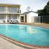 Raceway Motel, Whanganui: outdoor swimming pool in front of two-story motel buildings