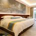 Anhui Construction New Era Hotel Bengbu guest room with king bed and large window view