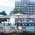 Rede Andrade Atlântico in Piçarras with outdoor pool, lounge chairs and oceanfront view