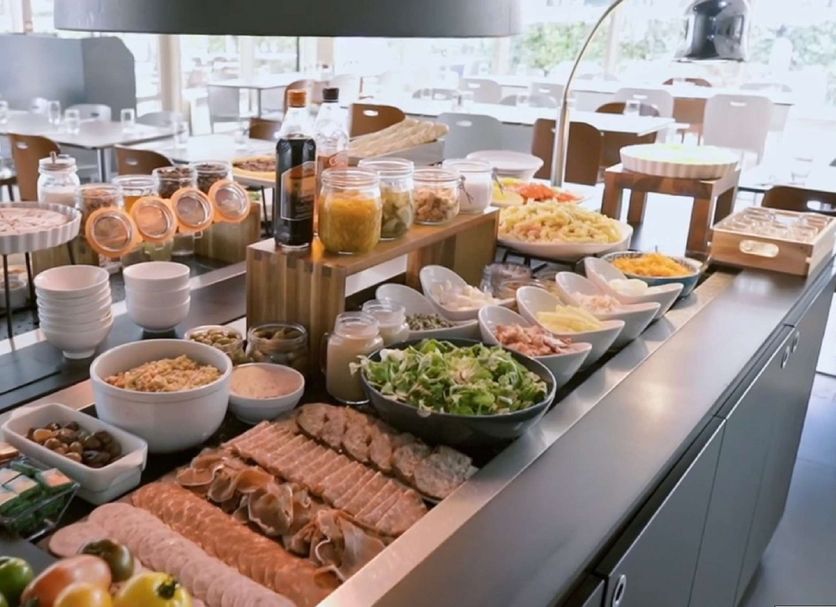 Campanile Paris Ouest - Gennevilliers Barbanniers breakfast buffet with pastries, fruit, salad and cold meats