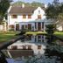 Bronte Hotel Harare exterior with manicured garden and reflecting pool