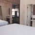 Resort L'acqua Diroma V room in Caldas Novas with twin beds, TV and wardrobe mirror