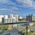 Sai Sangam Hotel in Shirdi balcony with glass railing and city view under a blue sky