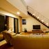 Kokol Haven Resort in Kota Kinabalu living room with leather sofas and staircase lighting