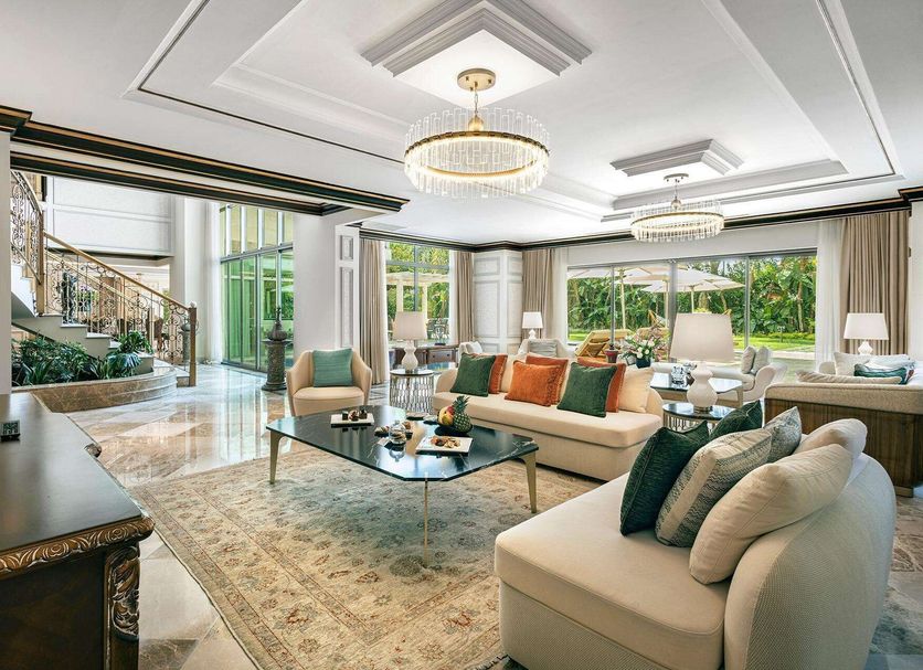 Ela Excellence Resort Belek lobby lounge with chandeliers, sofas, marble floors and garden views