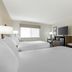 Best Western Timberridge Inn Grove guest room with two beds, TV, desk, and window
