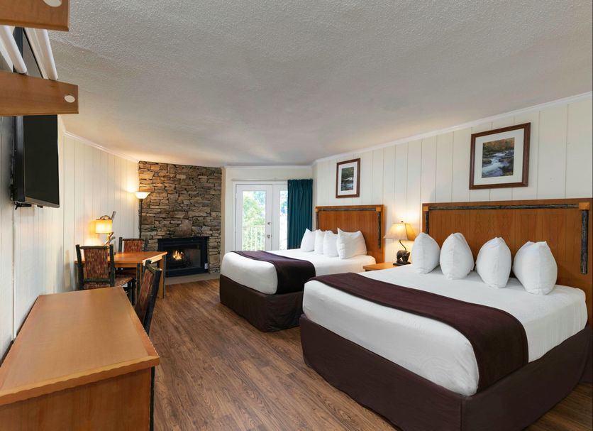 River Terrace Resort & Convention Center in Gatlinburg, guest room with two beds and stone fireplace
