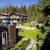 Sunwapta Falls Rocky Mountain Lodge in Jasper with lodge buildings, green lawn, and forested surroundings