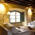 Hacienda Zorita Wine Hotel & Spa in Valverdón lounge with stone walls, wood beams, and white sofas