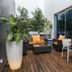 Hotel Santiago in Praia: outdoor terrace with lounge seating, dining table, potted plants and wood deck