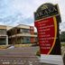 Akasa Hotel in Pakem exterior with parking area and entrance sign