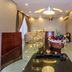 Arabella Residence Cairo dining room with fruit basket, glass table and mirrored ceiling lights