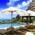 Kafuu Resort Fuchaku Condo Hotel in Onna with infinity pool overlooking the ocean and loungers