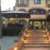 Villa Ambrosina in Impruneta with lit entrance steps, umbrellas, and a classic hotel facade