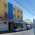 Hotel Nacional Montes Claros exterior on a street in Montes Claros with parked cars and storefronts