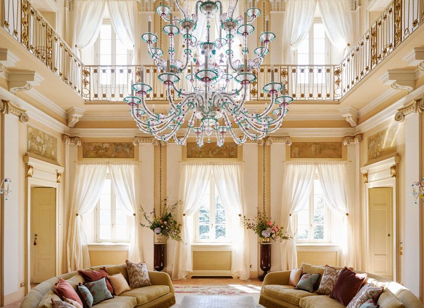 Passalacqua in Moltrasio: grand double-height lounge with ornate chandelier and tall windows
