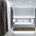 Hotel Indalo Park in Santa Susanna: modern guest room with king bed, soft lighting, and floor-to-ceiling curtains