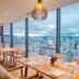 Tms Hotel Da Nang Beach in Da Nang dining room with city and mountain views through floor-to-ceiling windows