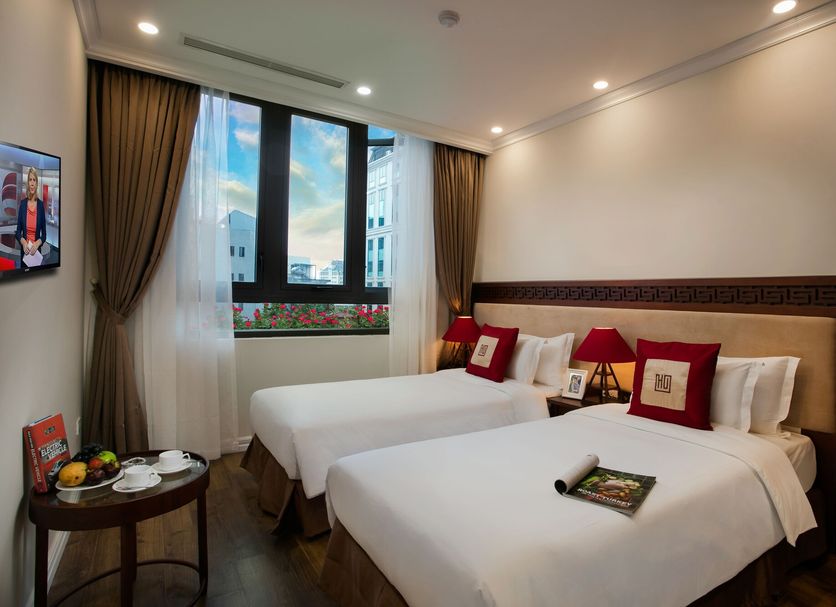 Au Coeur d'Hanoi Apartment in Hanoi offers a twin-bed guest room with window view and seating area.