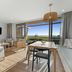 Tasman Holiday Parks - Papamoa Beach room with seating area and ocean view balcony in Papamoa