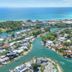 Caribbean Noosa in Noosa Heads with aerial views of a canal network and the ocean beyond