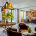 Buenos Aires Ezeiza Airport Marriott lounge with seating, pendant lights, and large windows in Buenos Aires