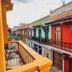 Balcony view of colorful colonial buildings at Hostal Casa Torres Centro Historico - Adults Only in Cartagena