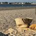La Palmeraie in La Baule-Escoublac: beach picnic setup with bike, straw bag and cushion by the water